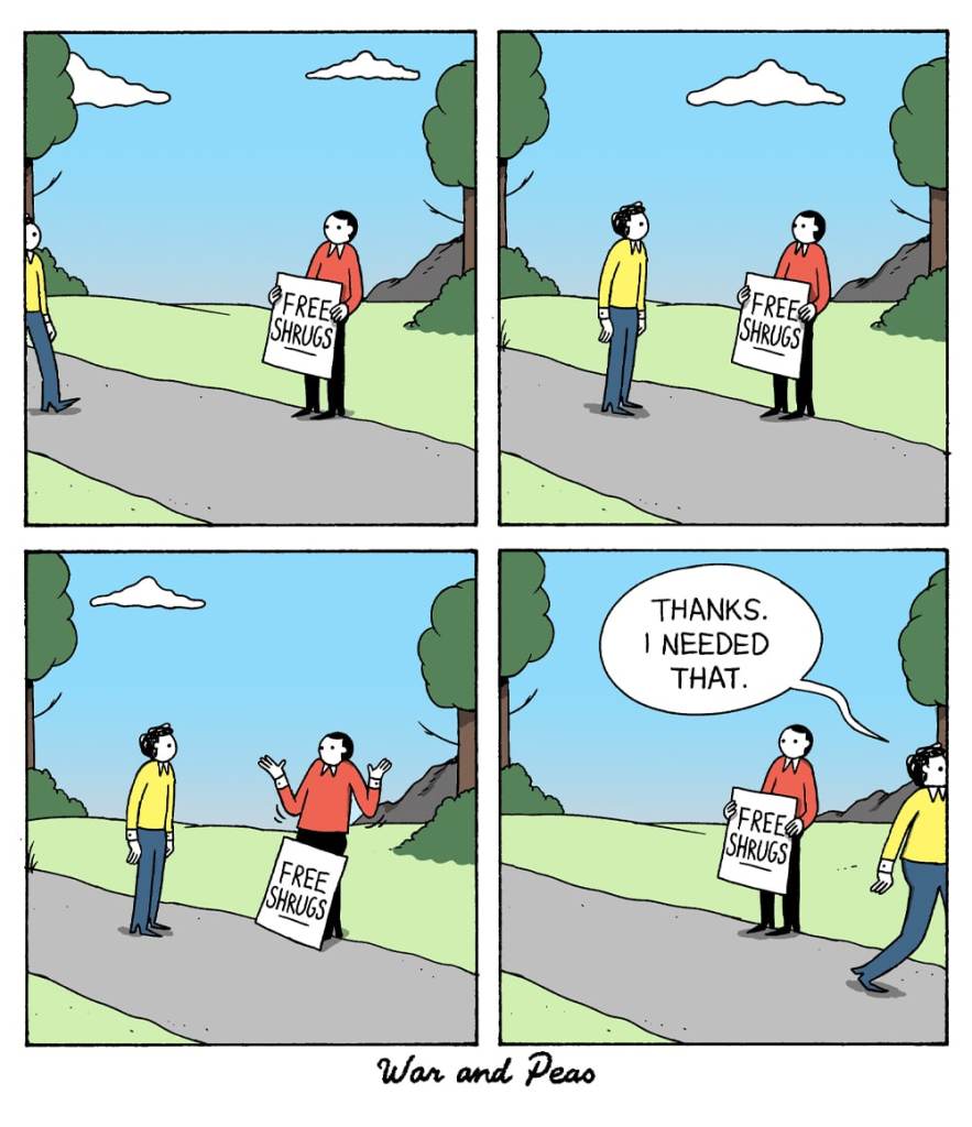 4-panel comic by War and Peas. Panel 1: A person stands on a path holding a sign that reads "FREE SHRUGS." Panel 2: Another person approaches, looking at the "FREE SHRUGS" sign. Panel 3: The person holding the sign gives a shrug. Panel 4: The second person, smiling and walking away, says, "Thanks. I needed that."
