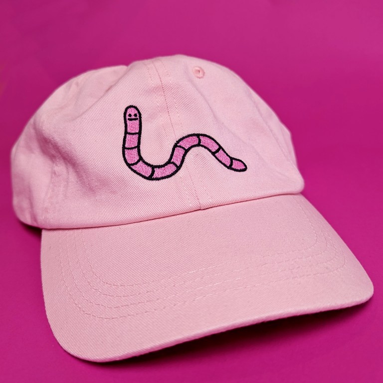 pink dad cap with pink worm on pink background - 1